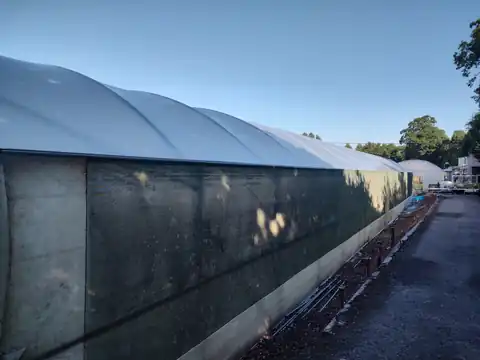 Long side elevation of a refurbished commercial polytunnel at Bodmin Nursery